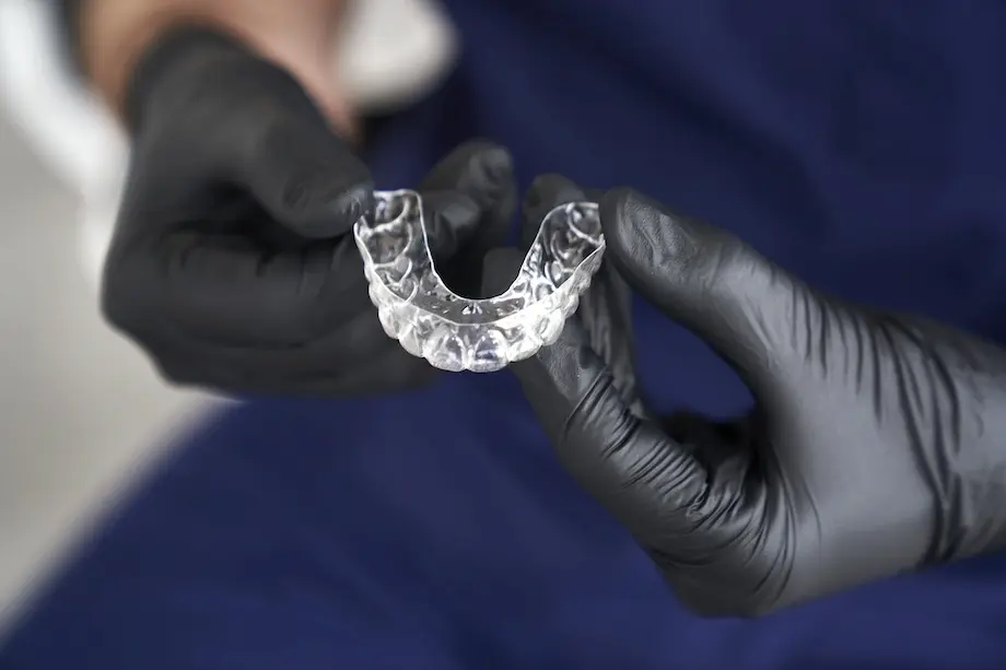 dentist holding retainers in his hands 2026 03 13 04 13 06 utc1