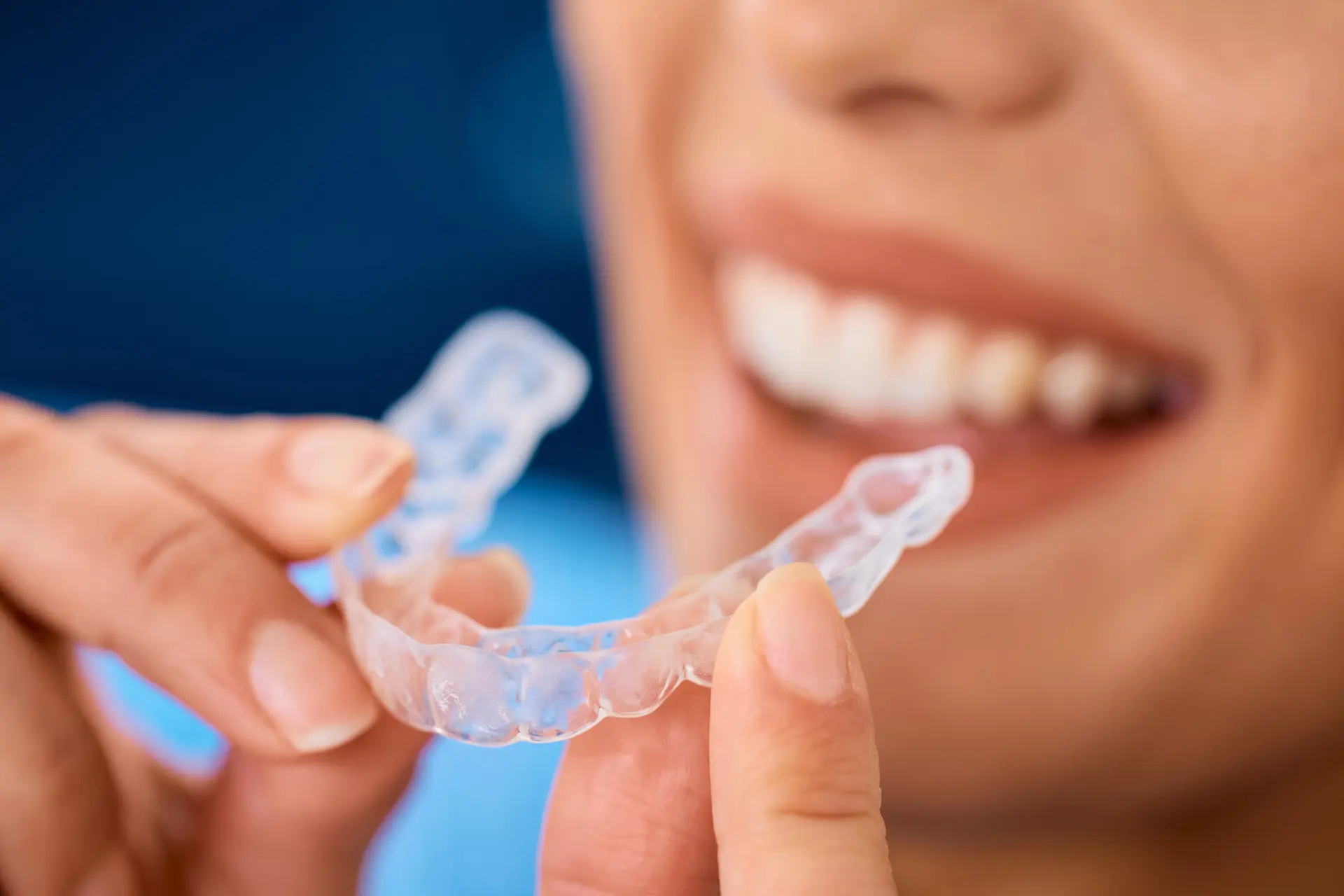 close up of woman using invisible dental aligners 2026 03 17 07 07 57 utc